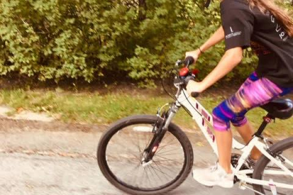 Young girl riding bike on local street in Hubbards.