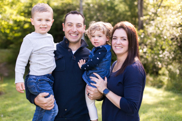 Kate Brown and her beautiful family are smiling for the camera.